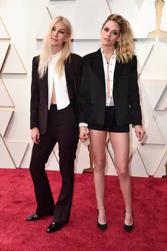 Dylan Meyer, left, and Kristen Stewart arrive at the Oscars